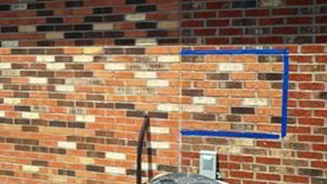 In the blue-taped area is an example of how a staining sample can be represented or viewed for approval by the owner.